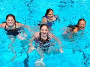 Hollie Blackburn (left), 11; Hannah Blackburn, 13; Madison Hanson, 12 and Kiera Gerich, 13, were a few of the first patrons to swim at the West Perth Lions Pool when it opened last Saturday, June 6. ANDY BADER/MITCHELL ADVOCATE