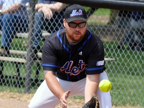 Mitchell Mets first baseman Bret Kraemer follows the ball to his glove during action Sunday in the ‘A’ semi-final against Waterdown, a 7-0 loss. The Hammer would go undefeated and take top honours in the tournament. ANDY BADER/MITCHELL ADVOCATE