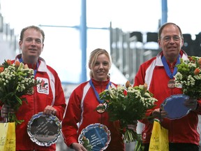 Sean Grassie (left) and Alison Nimik won the bronze medal at the world mixed doubles curling championship in Italy in 2009.