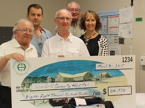 Dick Burgess (left), past-chair of the Huron Perth Healthcare Alliance Board and the current Seaforth-area board member; Dr. Andrzej Kluz, Ron Lavoie, chair of the Seaforth Hospital Foundation; Bill Scott, a member of the trustee board; and Anne Campbell, site administrator of the Seaforth hospital, site pose alongside the new defibrillator. MARCO VIGLIOTTI/POSTMEDIA NETWORK