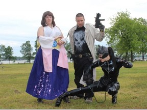SAMANTHA REED/For The Intelligencer
Lilly MonsterMeat (Cat Woman), Carl Godfrey (The Punisher) and Chelsea Cross (Luna) pose in Zwicks Park. Belleville’s Canada Day Committee has now added a costume role-playing (Cosplay) contest to this year’s activities.