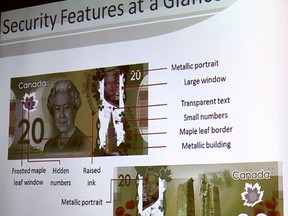 Some of the security features in Canada's polymer currency bills are noted during an identity theft and counterfeiting presentation to Sarnia Rotarians Monday. (Tyler Kula/Sarnia Observer/Postmedia Network)