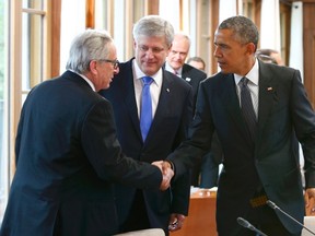 Canada's Prime Minister Stephen Harper and European Commission President Jean-Claude Juncker (L) greet U.S. President Barack Obama (R) before a working meeting at the G7 summit at Elmau Castle hotel in Kruen near Garmisch-Partenkirchen, southern Germany, June 8, 2015. Leaders of the Group of Seven (G7) industrial nations met on Sunday in the Bavarian Alps. REUTERS/Michaela Rehle