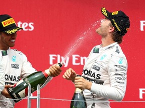 Canadian Grand Prix race winner Lewis Hamilton (left) and second-place finisher Nico Rosberg have made racing too predicable on the Formula 1 circuit. (AFP)