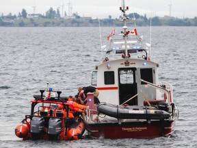 Kingston Fire and Rescue, in a joint effort with the Canadian Coast Guard, completed a successful water rescue in Kingston on Monday off the shore of Lake Ontario near Kingston General Hospital. (Julia McKay/The Whig-Standard)