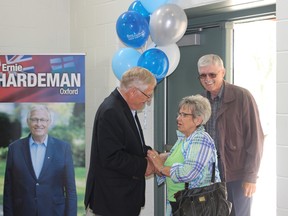 Ernie Hardeman greets Maria and Jack Clingo at a celebration marking his 20th year as Oxford's MPP on Monday, June 8. (MEGAN STACEY/Sentinel-Review)