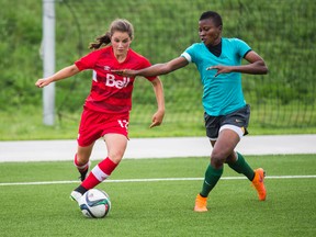 Canada's women's national team member Jessie Fleming and Nigeria during Women’s World Cup training match held at KIA Training Ground at Downsiew Park in Toronto on May 25, 2015. (Ernest Doroszuk/Toronto Sun/Postmedia Network)