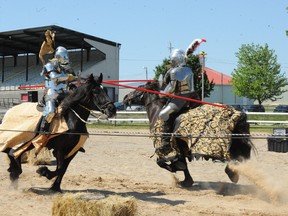 Two members of the Knights of Valour jousting team have at it during a display of the medieval arts. Organizers expect about 2,500 fans to attend a jousting competition Friday at the London Agriplex. (File photo)