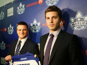 Kyle Dubas, Maple Leafs assistant general manager, introduces the Toronto Marlies new head coach Sheldon Keefe (left) at Ricoh Colliseum in Toronto on Monday June 8, 2015. (Stan Behal/Toronto Sun)