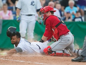 Argenis Vargas of the London Majors is tagged out at home by Brantford Red Sox catcher Brandon Dailey trying to score on a ground ball hit down the third base line during their game against the Brantford Red Sox at Labatt Park. The Majors scored twice in the inning on two runs, and lead 2-0 at the top of the third. (MIKE HENSEN, The London Free Press)