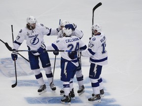 Tampa Bay Lightning winger Ryan Callahan (24) celebrates with centre Cedric Paquette (13), defenceman Victor Hedman (77) and centre Alex Killorn (17) after scoring against the Chicago Blackhawks in Game 3 of the Stanley Cup Final Monday at United Center. (David Banks/USA TODAY Sports)