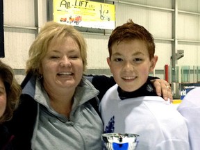 Submitted photo
Kim Sebrango and her son Donovan after winning the Toronto Challenge Cup at the Powerade Centre in Brampton last month. Donovan was playing spring hockey with the Pro Hockey Development group.