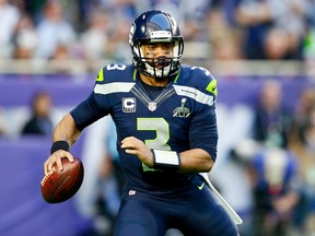 Russell Wilson #3 of the Seattle Seahawks looks to pass in the first quarter against the New England Patriots during Super Bowl XLIX at University of Phoenix Stadium on February 1, 2015 in Glendale, Arizona. (Kevin C. Cox/Getty Images/AFP)