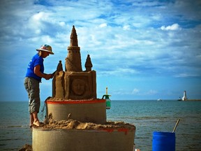 A top summer event is the Cobourg Sandcastle Festival where sculptor Sandi Stirling creates a work of sand art on the beach. (Photo by Stephen Della Casa)