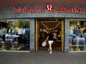 A woman walks into a store of yogawear retailer Lululemon Athletica in downtown Vancouver in this June 11, 2014 file photo.  Lululemon is expected to announce Q1 results on June 9. (REUTERS/Ben Nelms/Files)