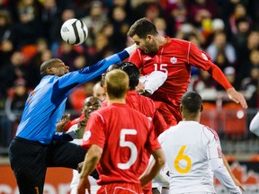 David Edgar of Canada and Odelin Molina, the goalkeeper for Cuba, during World Cup qualifying action at BMO field on Oct 12, 2012. (ERNEST DOROSZUK/Toronto Sun)