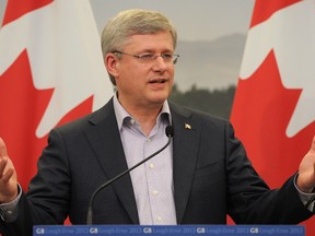 Canada's Prime Minister Stephen Harper attends a news conference after a G8 summit at the Lough Erne golf resort in Enniskillen, Northern Ireland June 18, 2013.  In March 2014, the G8 assembly of countries became the G7 when they decided to boot Russia out for its annexation of Crimea.  REUTERS/Ben Stansall/Pool