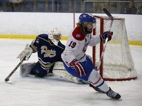 Kingston Voyageurs’ Adam Brady scores on Toronto Patriots goalie Mathew Robson during Game 2 of the Ontario Junior Hockey League championship series at the Invista Centre on April 12. (Whig-Standard file photo)