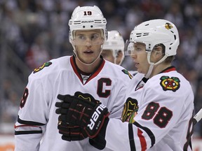 Chicago Blackhawks forwards Jonathan Toews and Patrick Kane talk things over prior to a faceoff in the Winnipeg Jets zone during NHL action at MTS Centre on Nov. 2, 2013. (Kevin King/Winnipeg Sun/QMI Agency)