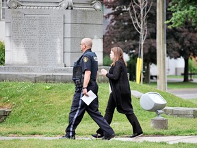 Kirsten Pemberton is escorted out of the Lennox and Addington County Courthouse after a bail hearing on Tuesday. (Meghan Balogh/Postmedia Network)