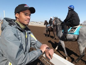 Jockey Quincy Welch watches exercise riders work with horses at Northlands Park in Edmonton. Welch will be honoured on Sunday at Woodbine when he is presented the Avelino Gomez memorial award. (DAVID BLOOM/Postmedia Network files)
