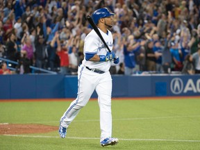 Blue Jays batter Edwin Encarnacion reacts after hitting a two-run home run during the ninth inning against the Marlins in Toronto on Tuesday, June 9, 2015. (Nick Turchiaro-USA TODAY Sports)