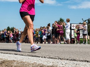 Theresa Carriere acknowledges her supporters during her 2014 ONERUN from Sarnia to London.