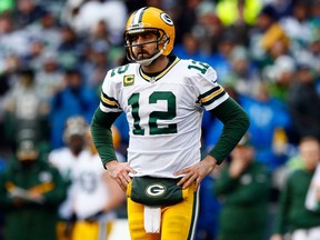 Aaron Rodgers of the Green Bay Packers reacts against the Seattle Seahawks during the 2015 NFC Championship game at CenturyLink Field on January 18, 2015. (Kevin C. Cox/Getty Images/AFP)
