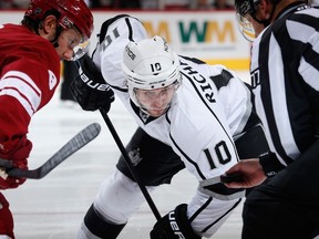 Mike Richards #10 of the Los Angeles Kings awaits a face off against Sam Gagner #9 of the Arizona Coyotes during the second period of the NHL game at Gila River Arena on December 4, 2014 in Glendale, Arizona. (Christian Petersen/Getty Images/AFP)