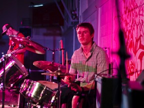 The St. Mike's rock band concert literally had the audience twisting and shouting. Here Brandon Birkmann (left) rocks the guitar and Bradin McClelland (right) sets the beat on the drums. John Stoesser photos/Pincher Creek Echo.