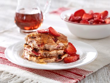 Strawberry Oatmeal PancakesStrawberries add a burst of flavour and moistness to these very tasty and satisfying pancakes.Ingredients:1-1/4 cups (300 ml) buttermilk1 cup (250 ml) large-flaked rolled oats1 cup (250 ml) all-purpose flour1 tsp. (5 ml) each baking powder, baking soda and cinnamon1/4 tsp. (1 ml) salt2 eggs2 Tbsp. (30 ml) maple syrup2 Tbsp. (30 ml) vegetable oil (approx.)1 tsp. (5 ml) vanilla1 cup (250 ml) diced strawberries1-1/2 cups (375 ml) sliced strawberriesDirections:In large bowl, combine buttermilk with oats; let stand for 10 minutes. In medium bowl, whisk together flour, baking powder, baking soda, cinnamon and salt; stir into oat mixture. In small bowl, whisk together eggs, maple syrup, oil and vanilla. Stir into oat mixture.Gently stir in diced strawberries. Heat large non-stick skillet over medium heat. Brush with thin layer of oil. For each pancake, drop 1/4 cup (60 ml) batter onto skillet and cook for 4 minutes or until edges are dry and bottoms are golden.Flip and cook for 2 minutes or until golden and puffed. Repeat with remaining batter, brushing with oil between batches and adjusting heat as necessary. Serve topped with sliced strawberries.Makes 12 pancakes. (Foodland Ontario)
