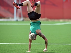 Australia's forward Michelle Heyman walks on her hands during a training session at the Shaughnessy Field in Winnipeg, Manitoba, on June 10, 2015, ahead of their 2015 FIFA Women's World Cup group D football match against Nigeria to be played on June 12.