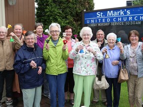 Parishioners and Rev. Linda Saffrey, second right, of St. Mark's United Church in Sudbury, Ont., ring bells to mark the 90th anniversary of the United Church of Canada on Wednesday June 10, 2015. A special service will be held on June 14 to celebrate the 75th anniversary of St. Mark's. John Lappa/Sudbury Star/Postmedia Network