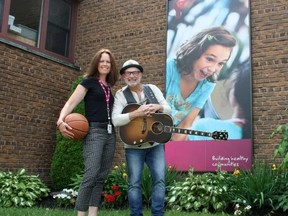 Sarah Hyatt/The Intelligencer
Supervisor of Membership Sales and Service of the Belleville YMCA Branch Jennifer McTavish and local entertainer Andy Forgie gear up for a Loonie Tunes show in support of the 2015 Strong Kids Campaign in Belleville Wednesday.