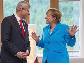 Germany's Chancellor Angela Merkel meets Canada's Prime Minister Stephen Harper during the G7 summit at the hotel castle Elmau in Kruen, Germany, June 7, 2015. Leaders from the Group of Seven (G7) industrial nations met on Sunday in the Bavarian Alps for a summit overshadowed by Greece's debt crisis and ongoing violence in Ukraine. REUTERS/Michael Kappeler/Pool