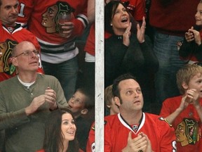 Actor Vince Vaughn (right) and his wife Kyla Weber attend a Blackhawks playoff game in 2010. Vaughn picked up the dinner tab of Lightning coach Jon Cooper and the team staff on Tuesday. (Jeff Haynes/Reuters/Files)