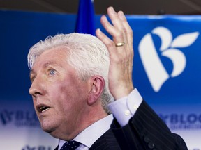 Gilles Duceppe gestures as he announces his return to federal politics as leader of the Bloc Quebecois during a press conference in Montreal, June 10, 2015. (CHRISTINNE MUSCHI/Reuters)