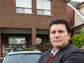 Toronto Catholic District School Board Trustee Frank D'Amico in front of his home in Toronto where he says his vehicle has been vandalized several times, Wednesday, June 10, 2015. (Dave Thomas/Toronto Sun)