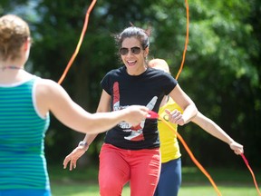 Pasqualina Cardu, organizer of Bringing Back Double Dutch, skips rope with friends Lisa Highfield and Montaha Jomaa at Piccadilly Park in London. Londoners are invited to join in the fun on June 20.  (CRAIG GLOVER, The London Free Press)