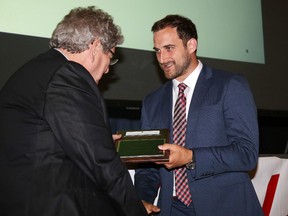 Nick Foligno accepts the professional athlete of the year award from Chris Sheridan, founder of the House of Kin and Greater Sudbury Sports Hall of Fame.