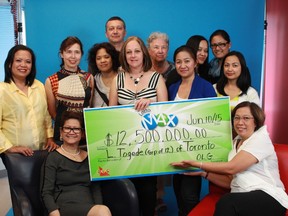 Mount Sinai health-care workers with their $12.5-million cheque from the June 5 Lotto Max draw Wednesday, June 10, 2015. (OLG)