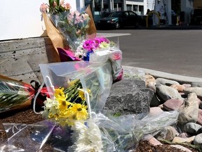 A memorial has been set up at the Centex gas station where hit-and-run victim Maryam Rashidi was killed during a gas-and-dash over the weekend in Calgary on Wednesday June 10, 2015. Darren Makowichuk/Calgary Sun/Postmedia Network