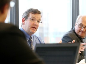 Dr. Sean Murray makes  his presentation the the LHIN's board meeting in Sudbury, Ont. on June 10, 2015, as  Dr. Denis Roy, president and CEO, Health Sciences North, looks on. Gino Donato/Sudbury Star/Postmedia Network