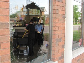 Staff at a Tim Hortons in Chatham clean up after a deer jumped through a window on Thursday, June 11, 2015. Blair Andrews, Postmedia Network