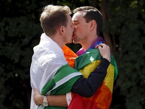 A couple embraces outside the count centre in Dublin as Ireland holds a referendum on gay marriage May 23, 2015. Ireland voted heavily in favour of allowing same-sex marriage in a historic referendum. North Carolina's government appears to be taking a different path on the issue. REUTERS/Cathal McNaughton