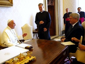 Pope Francis (L) meets Canada's Prime Minister Stephen Harper during a private audience at the Vatican City, June 11,2015. REUTERS/Tony Gentile