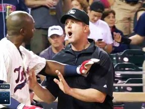 Twins' Torii Hunter takes it off after being ejected Wednesday night.