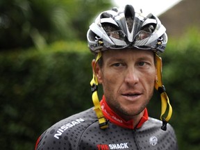 US cyclist Lance Armstrong as he arrives to participate in a training session during the second of the two rest days of the 2010 Tour de France cycling race at the hotel hosting the US cycling team in Pau, south west France. (AFP PHOTO/NATHALIE MAGNIEZ)
