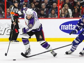 Binghamton Senators' Fredrik Claesson keeps the puck away from Toronto Marlies' Troy Bodie during AHL hockey action at the Canadian Tire Centre on February 15, 2015. Errol McGihon/Ottawa Sun files