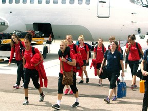 Team Canada members arrive on a charter flight at the Edmonton International Airport on August 13, 2014. FIFA has chartered planes at the 2015 Women's World Cup for teams to get to their next destination beginning Friday. (Tom Braid/Postmedia Network/Files)